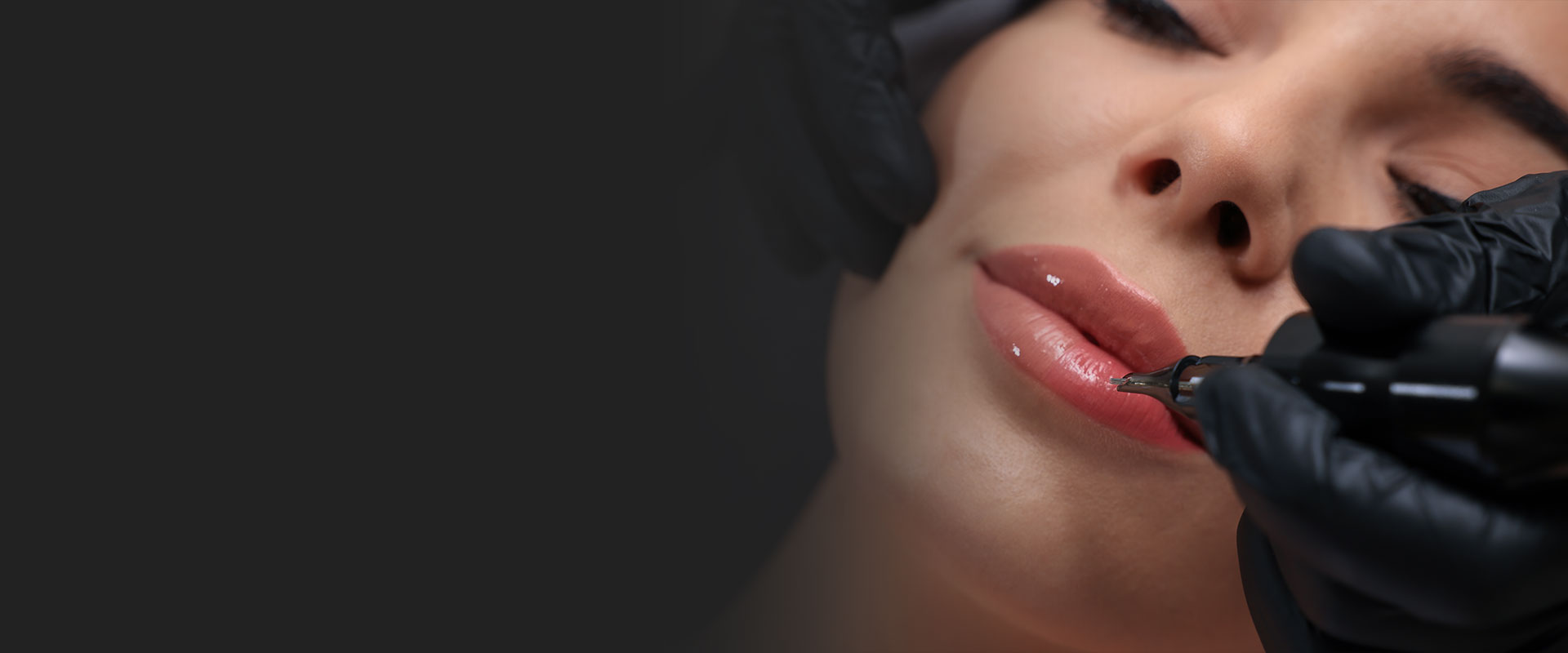 Lip Blushing in Madison and Huntsville Alabama Close-up of a woman receiving permanent lip color with a PMU machine